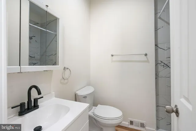 a bathroom with a sink and a toilet