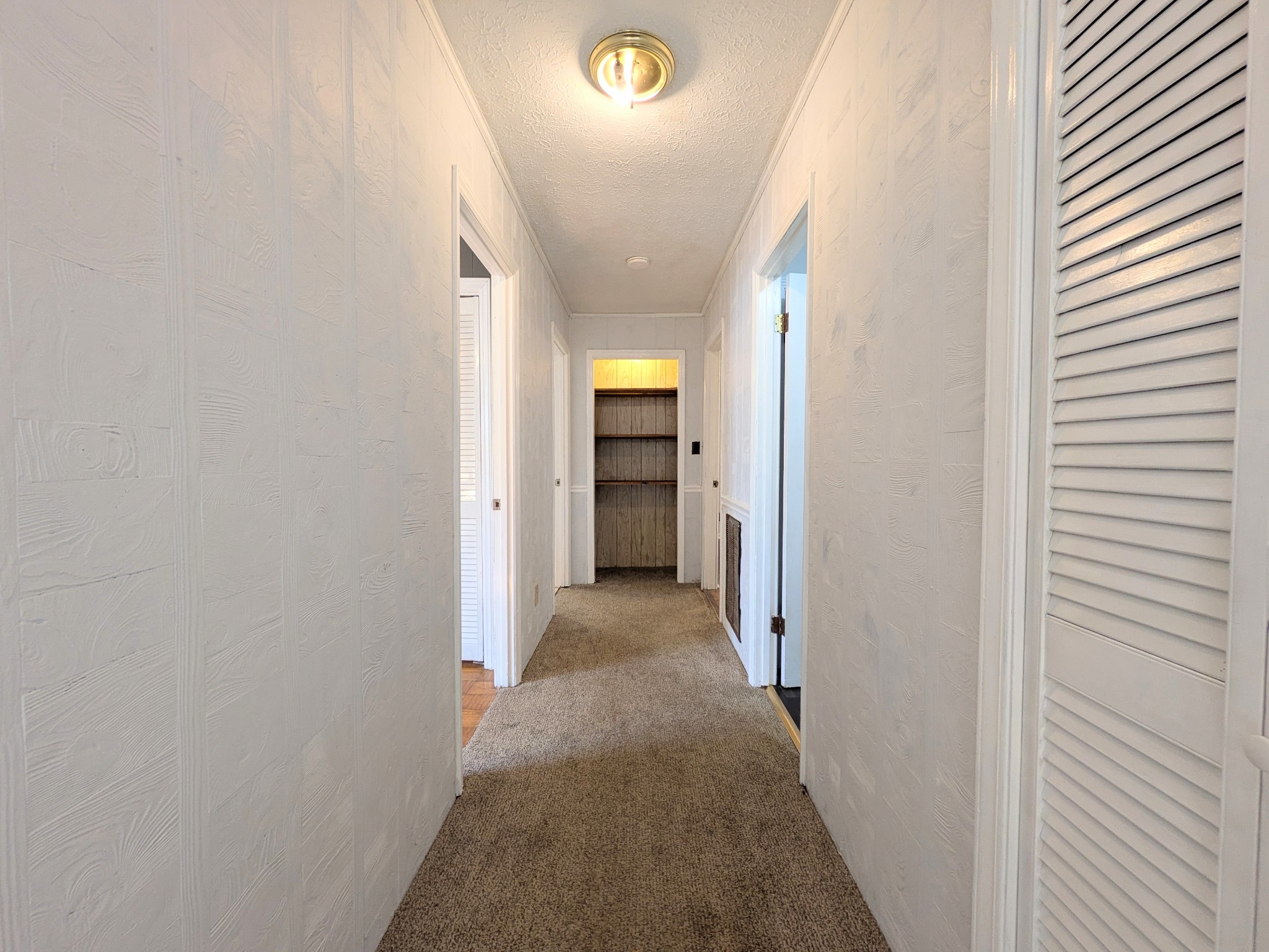3416 Erin Road McEwen, TN 37101 - Photo 13 of 43 a view of a hallway with wooden floor and a bathroom