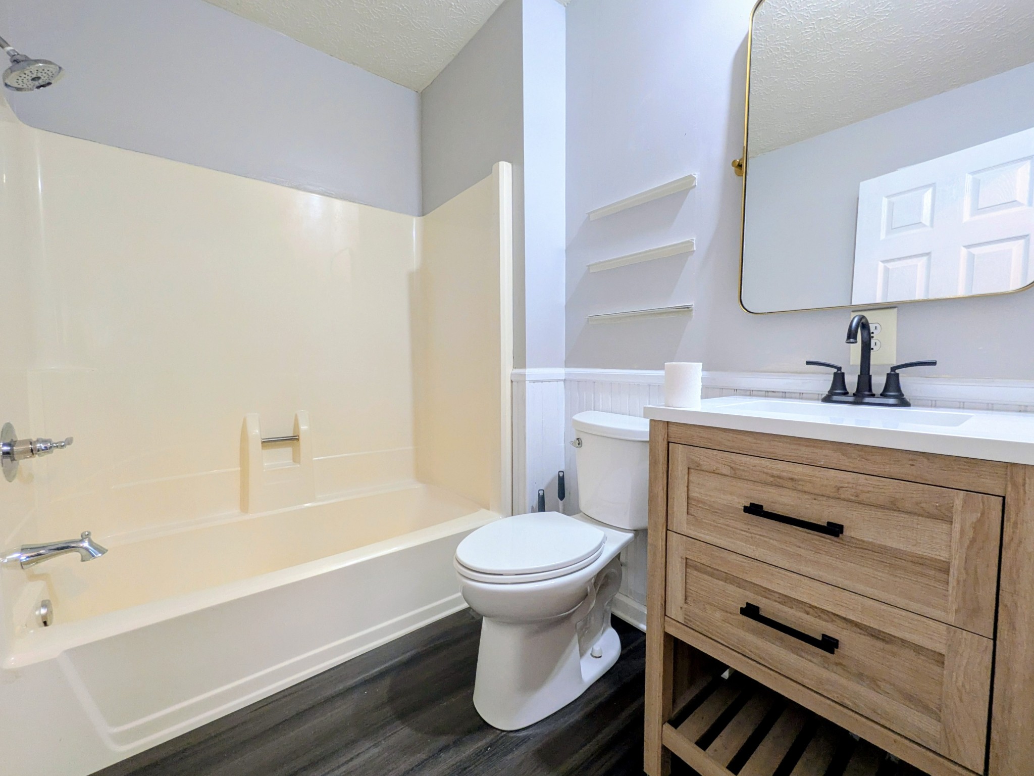 3416 Erin Road McEwen, TN 37101 - Photo 14 of 43 a bathroom with a sink toilet vanity and tub