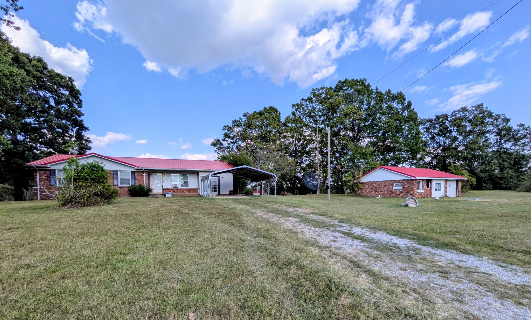 3416 Erin Road McEwen, TN 37101 - Photo 2 of 43 a front view of house with yard and trees
