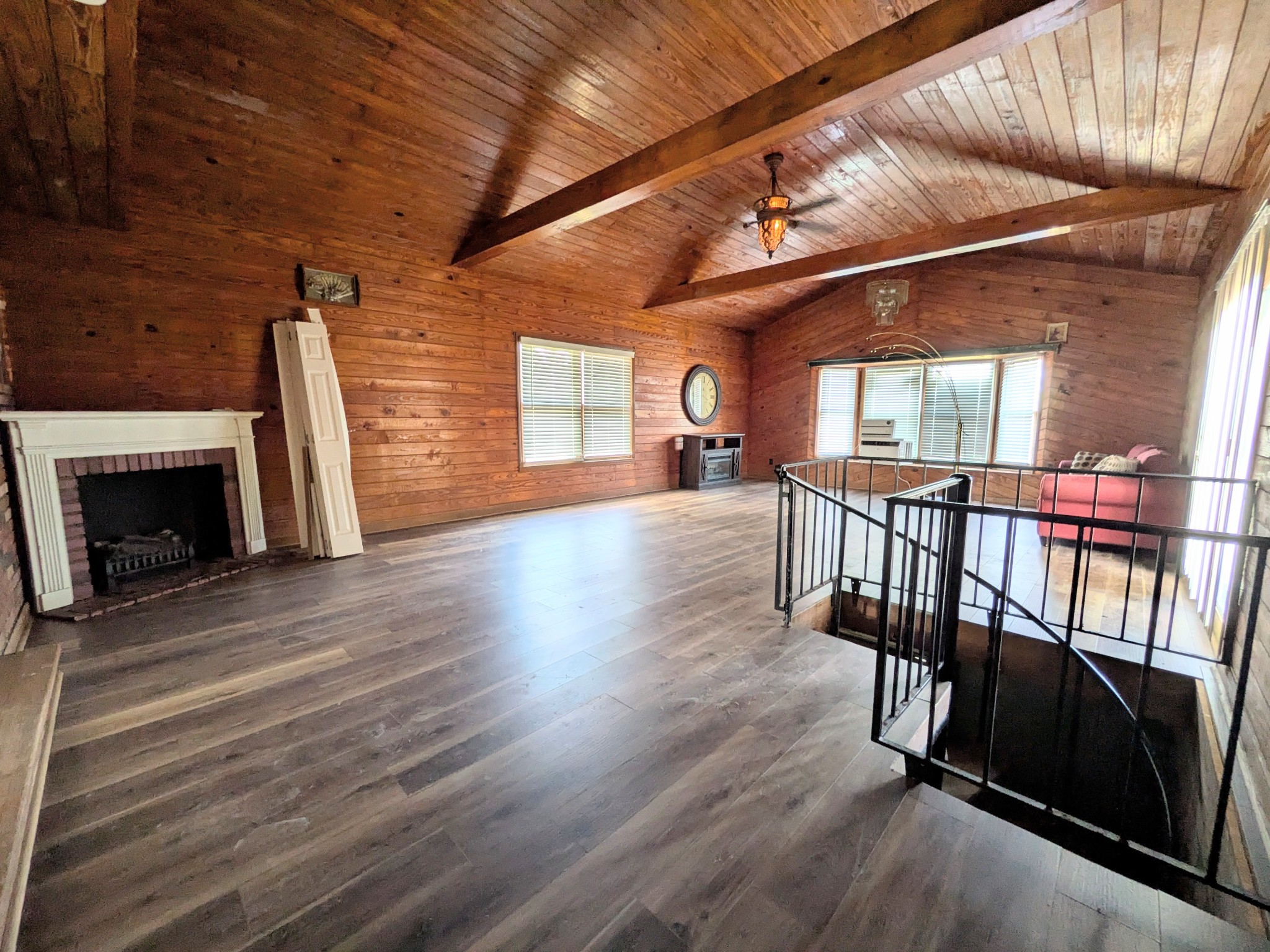 3416 Erin Road McEwen, TN 37101 - Photo 25 of 43 an empty room with wooden floor fireplace and windows