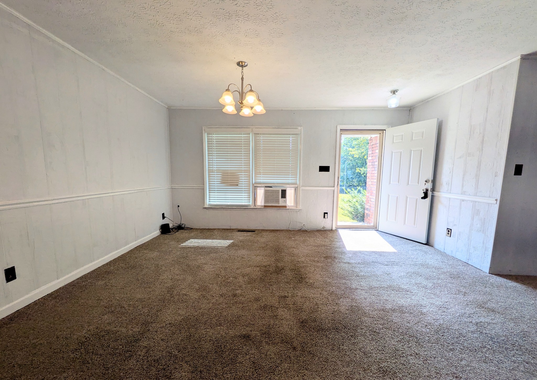 3416 Erin Road McEwen, TN 37101 - Photo 4 of 43 an empty room with windows and flowerpot