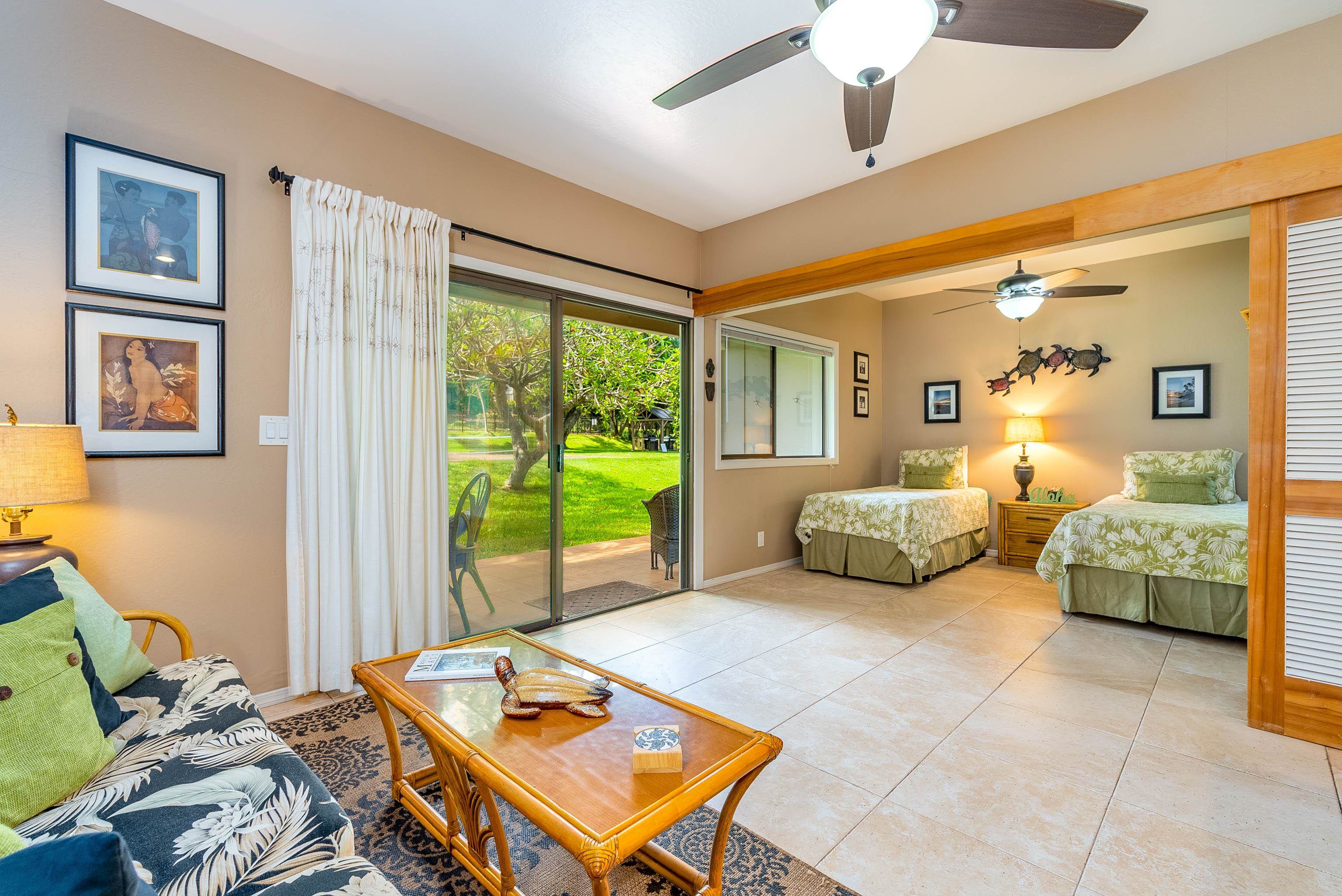 4440 Lower Honoapiilani Road, Unit 154 Lahaina, HI 96761 - Photo 13 of 32 a bedroom with furniture and a large window