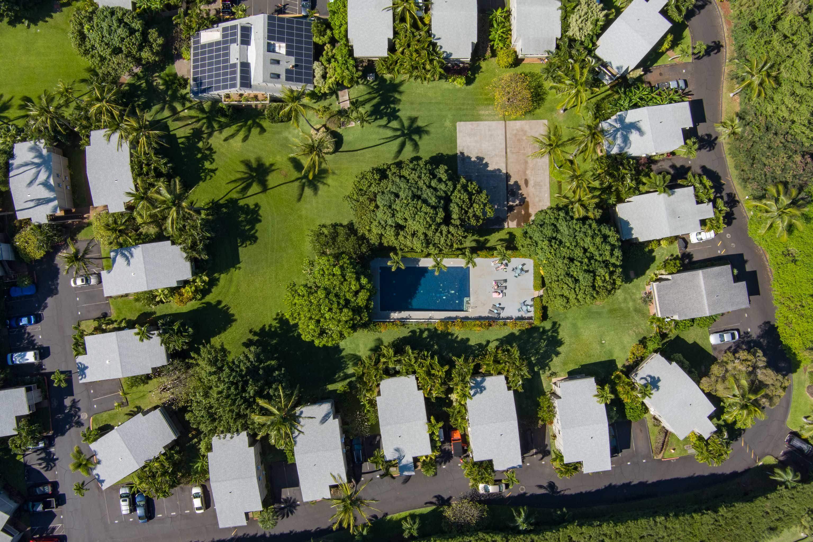4440 Lower Honoapiilani Road, Unit 154 Lahaina, HI 96761 - Photo 30 of 32 an aerial view of a house with a yard and large trees