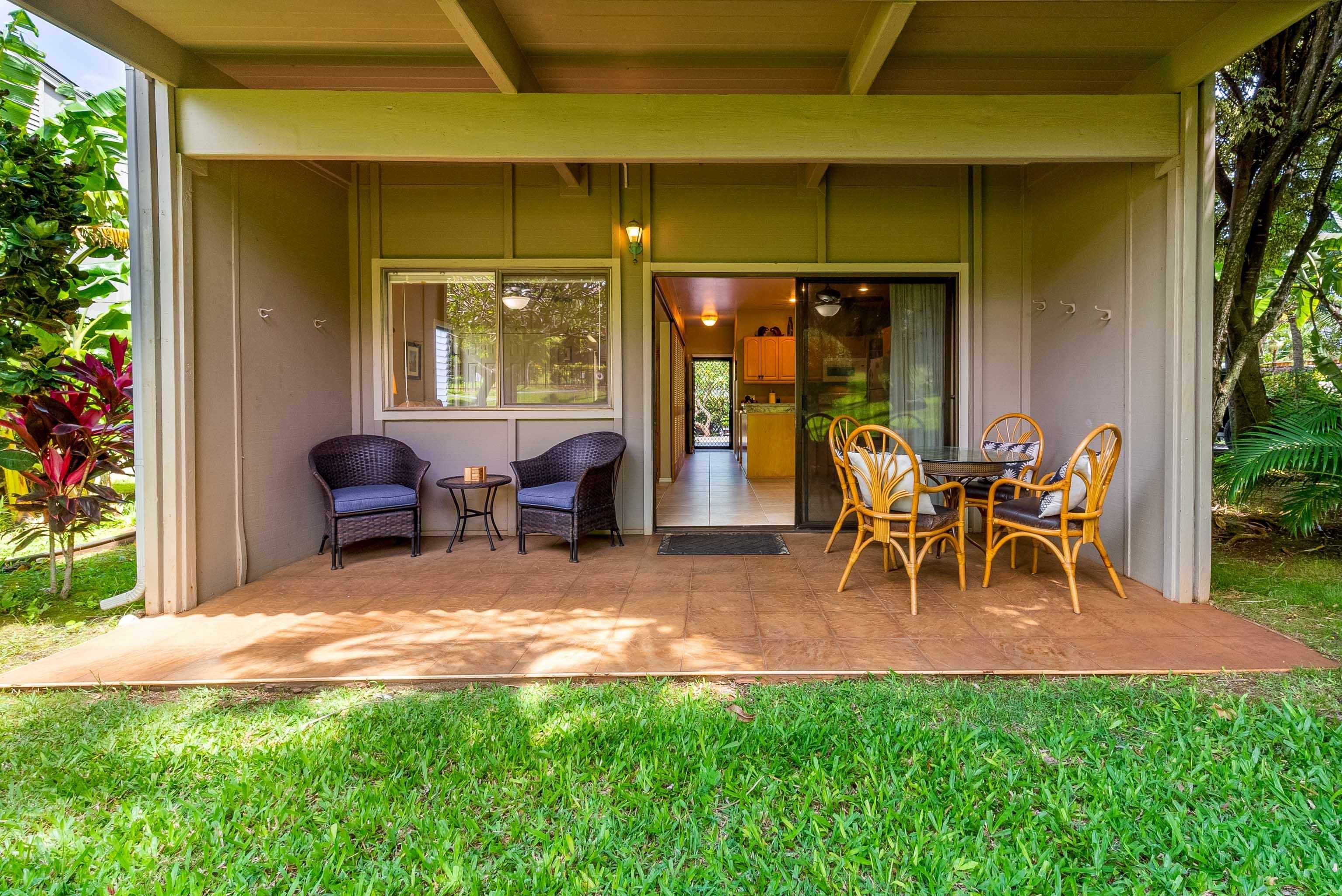 4440 Lower Honoapiilani Road, Unit 154 Lahaina, HI 96761 - Photo 8 of 32 a view of a porch with chairs and backyard