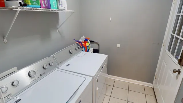 a utility room with dryer and washer