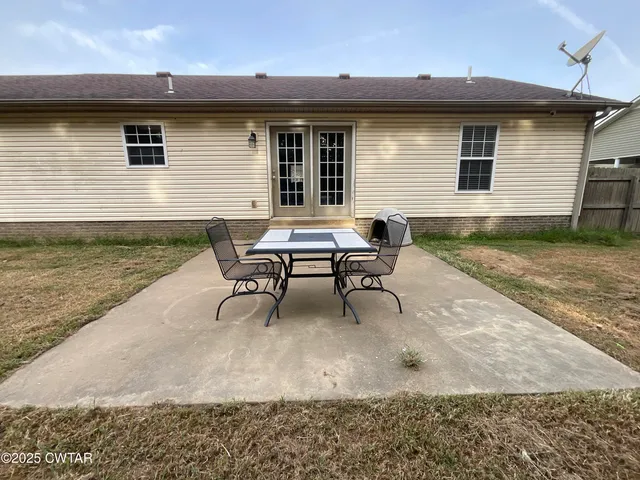 a view of a backyard with a small cabin