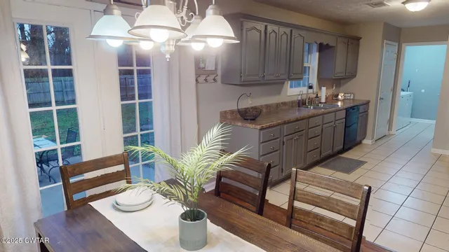 a kitchen with a table and chairs in it