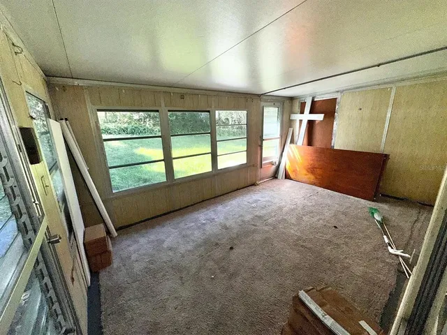 a bed room with a bed and a window