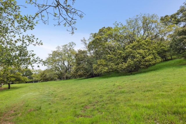 an outdoor space with swimming pool and furniture