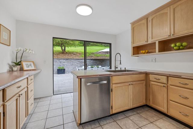 a kitchen with sink cabinets and window