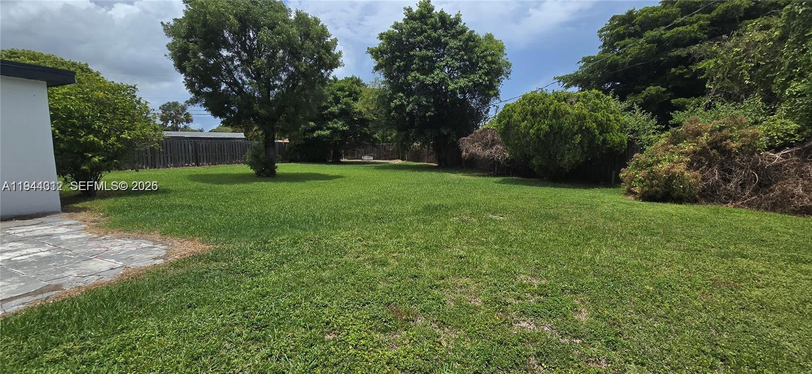 9805 Marlin Road Cutler Bay, FL 33157 - Photo 3 of 4 a view of a backyard with large trees