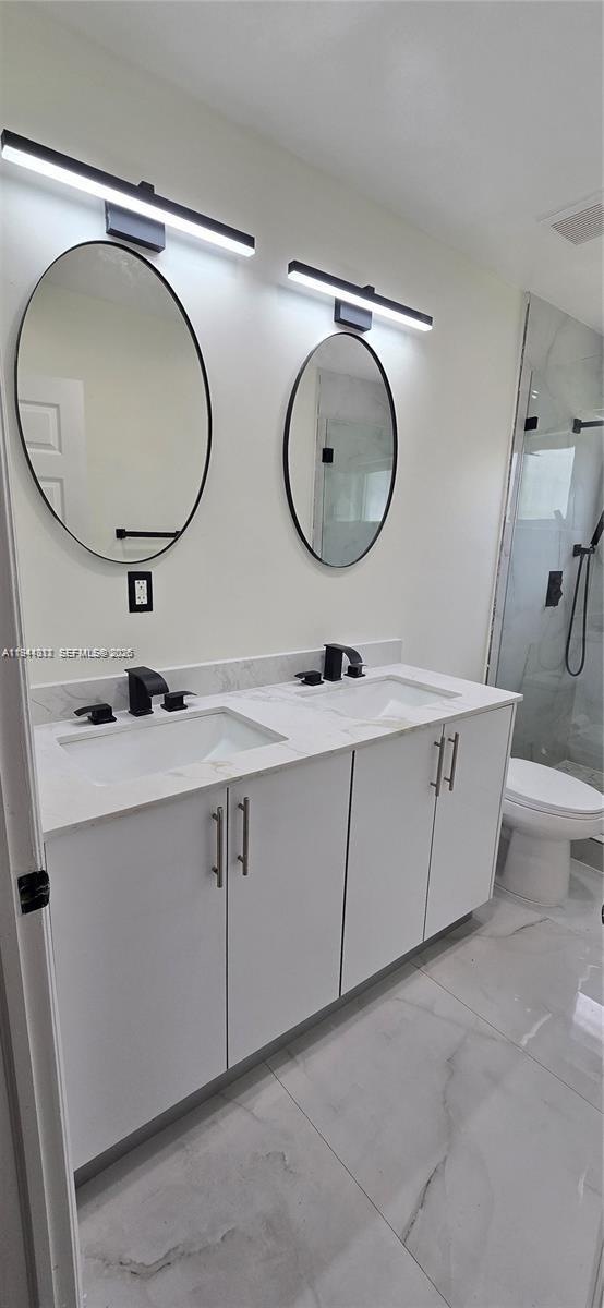 9805 Marlin Road Cutler Bay, FL 33157 - Photo 4 of 4 a bathroom with a sink mirror and vanity