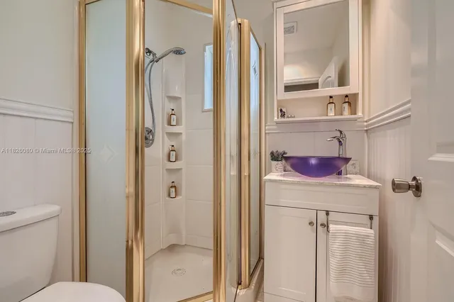 a bathroom with a shower and a mirror
