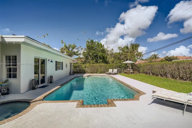 a view of swimming pool with a patio