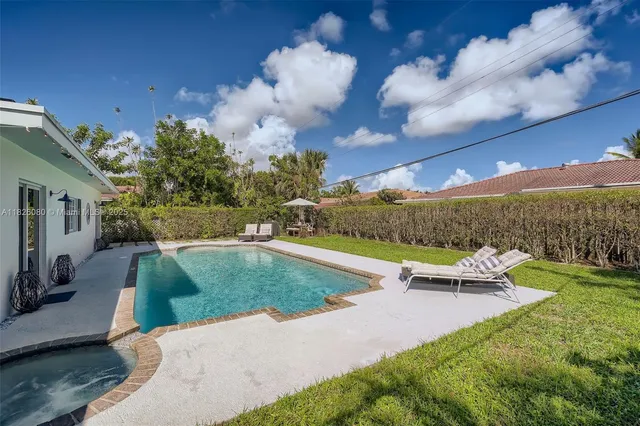 a view of a swimming pool with a patio