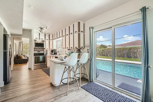a view of a living room and a wooden floor