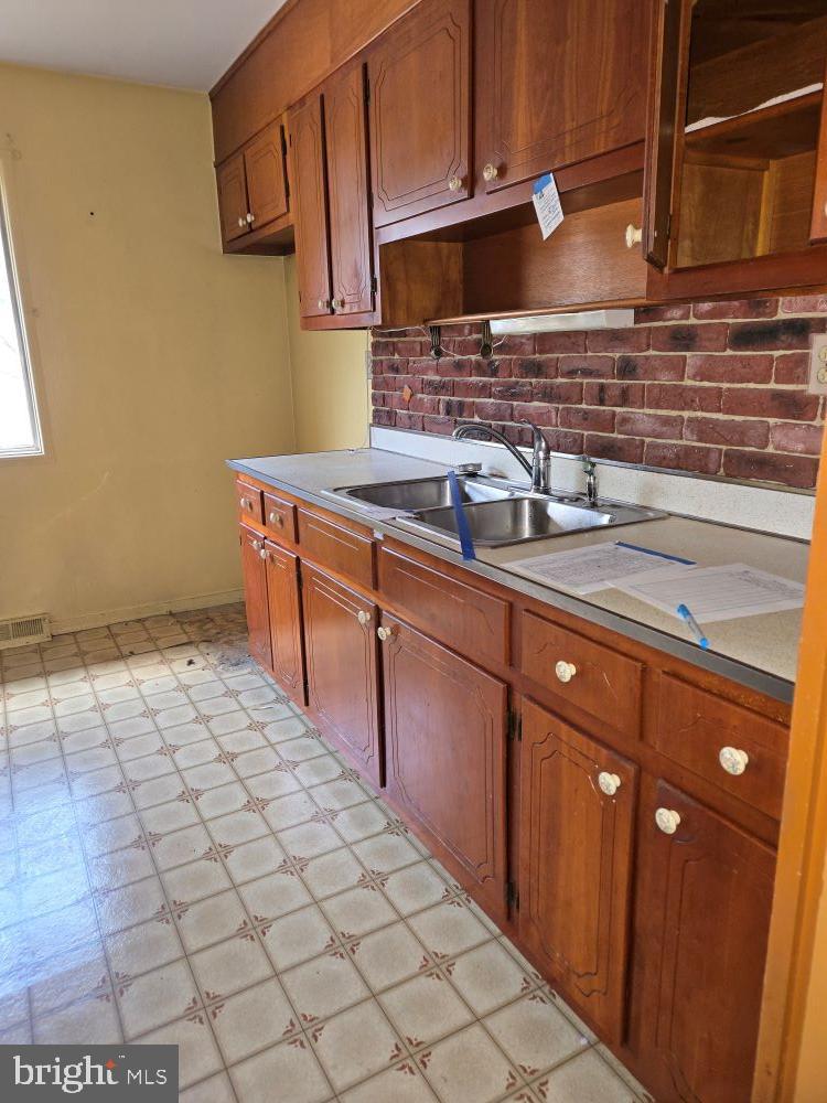 2034 Cherry Court Edgewood, MD 21040 - Photo 11 of 38 a kitchen with a sink and cabinets