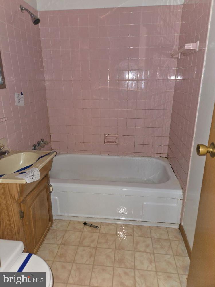 2034 Cherry Court Edgewood, MD 21040 - Photo 15 of 38 a bathroom with a bathtub and a shower