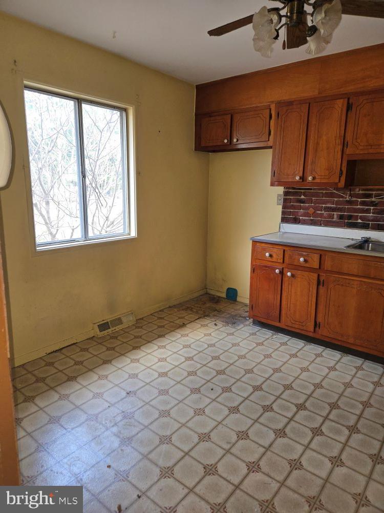 2034 Cherry Court Edgewood, MD 21040 - Photo 7 of 38 a kitchen with a sink window and cabinets
