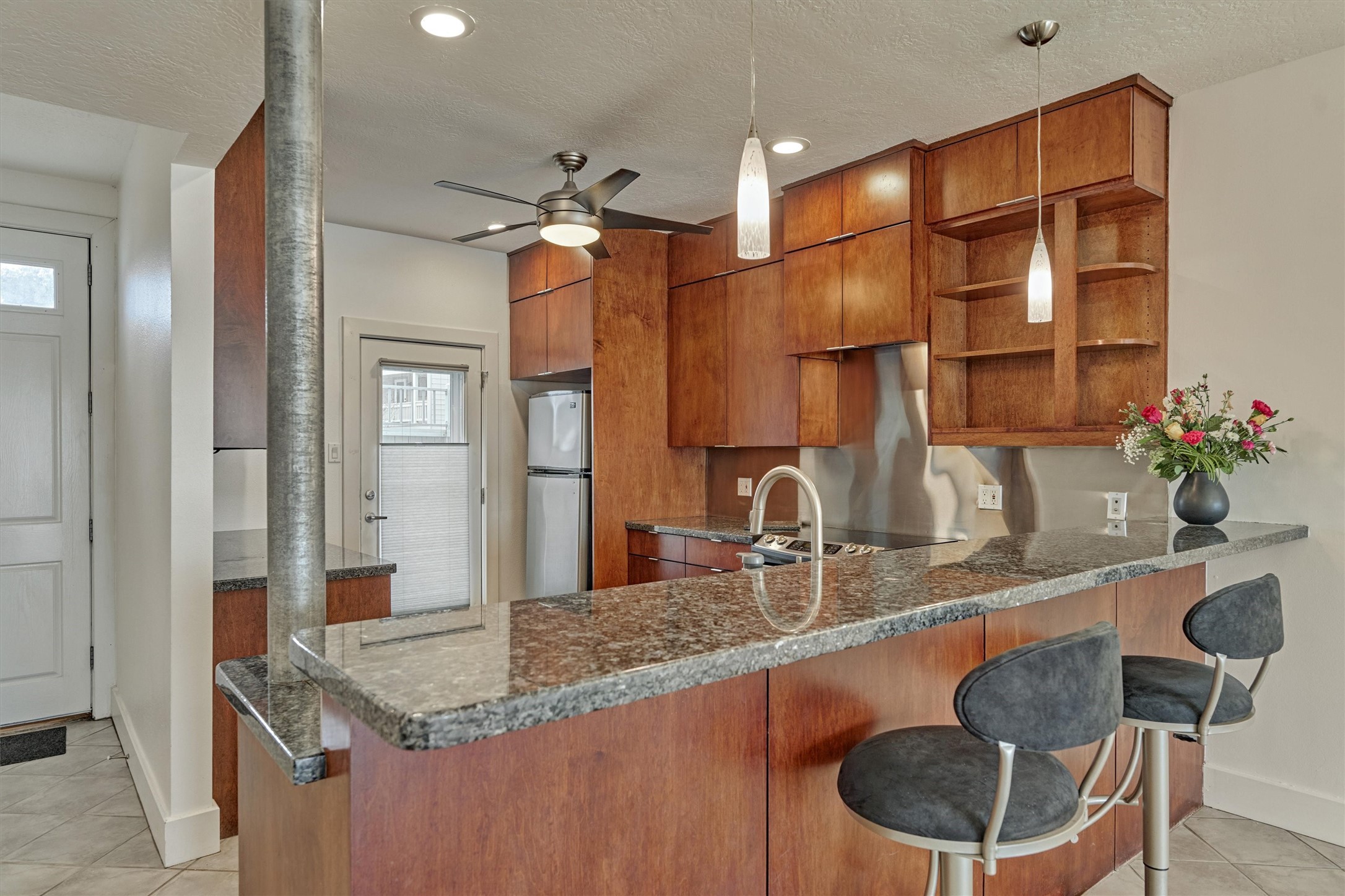 1427 Bowsprit Point Willis, TX 77318 - Photo 14 of 47 The long bar provides additional seating for up to four.