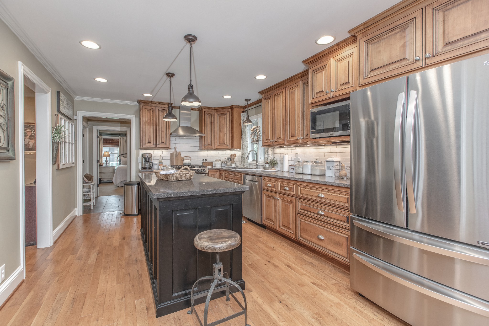 2013 Stratford Road Murfreesboro, TN 37129 - Photo 16 of 46 a kitchen with stainless steel appliances granite countertop a refrigerator a sink dishwasher a stove and white countertops with wooden floor