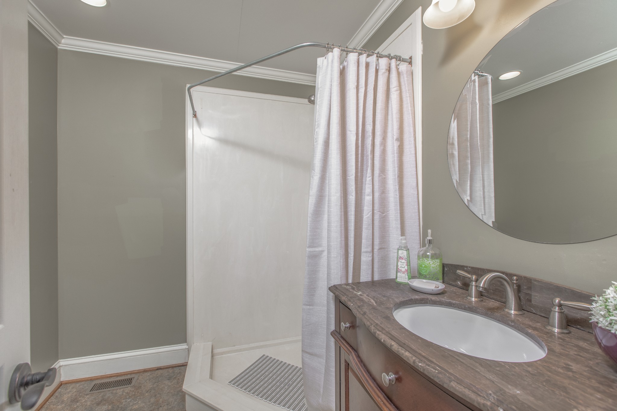 2013 Stratford Road Murfreesboro, TN 37129 - Photo 27 of 46 a bathroom with a granite countertop sink a mirror and a shower