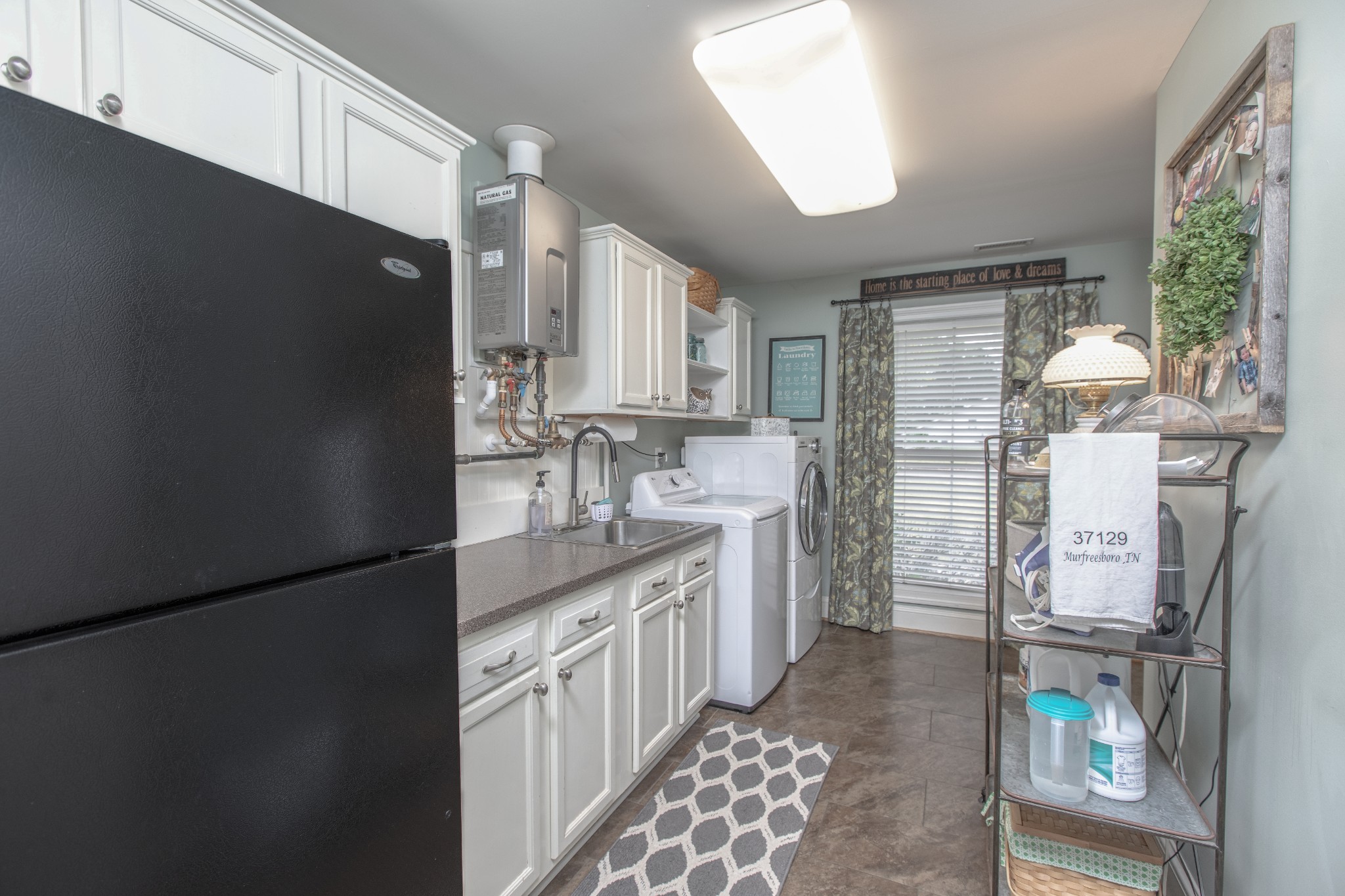 2013 Stratford Road Murfreesboro, TN 37129 - Photo 31 of 46 a kitchen with a sink appliances and cabinets