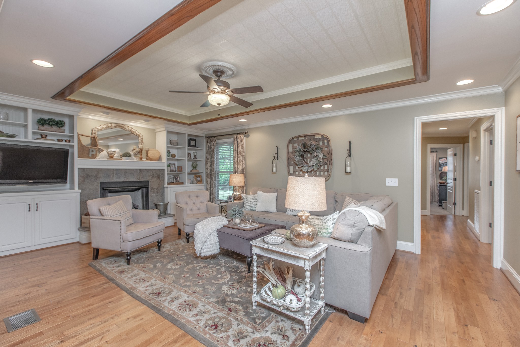 2013 Stratford Road Murfreesboro, TN 37129 - Photo 8 of 46 a living room with furniture a flat screen tv and a fireplace