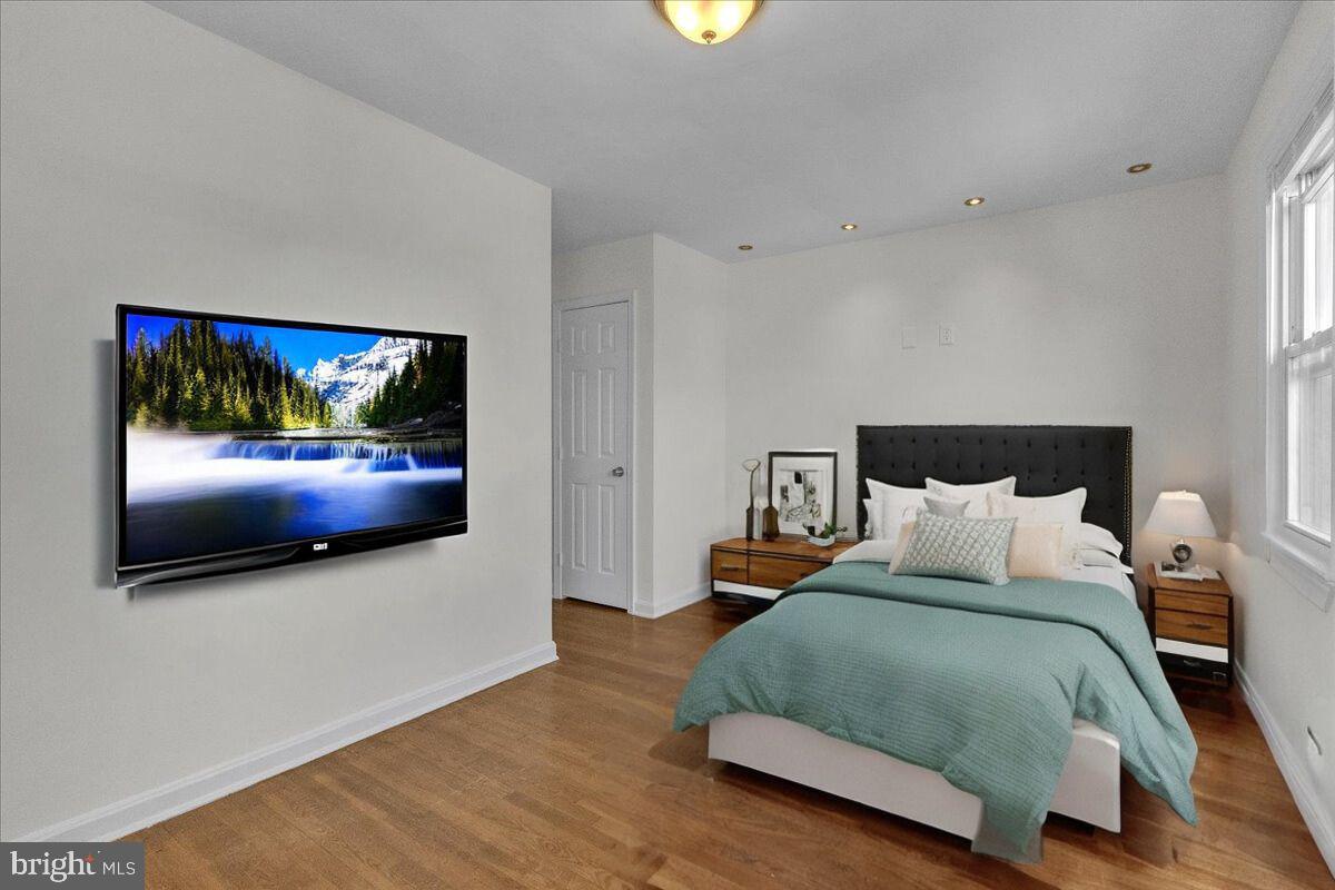 1193 46th Place Southeast Washington, DC 20019 - Photo 12 of 17 a bedroom with a bed and a flat screen tv