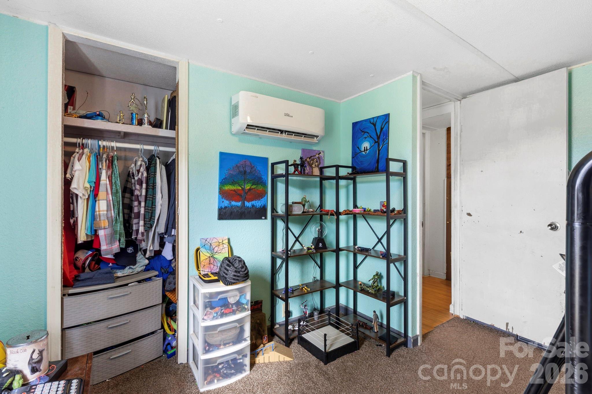 4 Mountain View Road Asheville, NC 28806 - Photo 26 of 35 a view of a bedroom with lots of stuff and hardwood floor