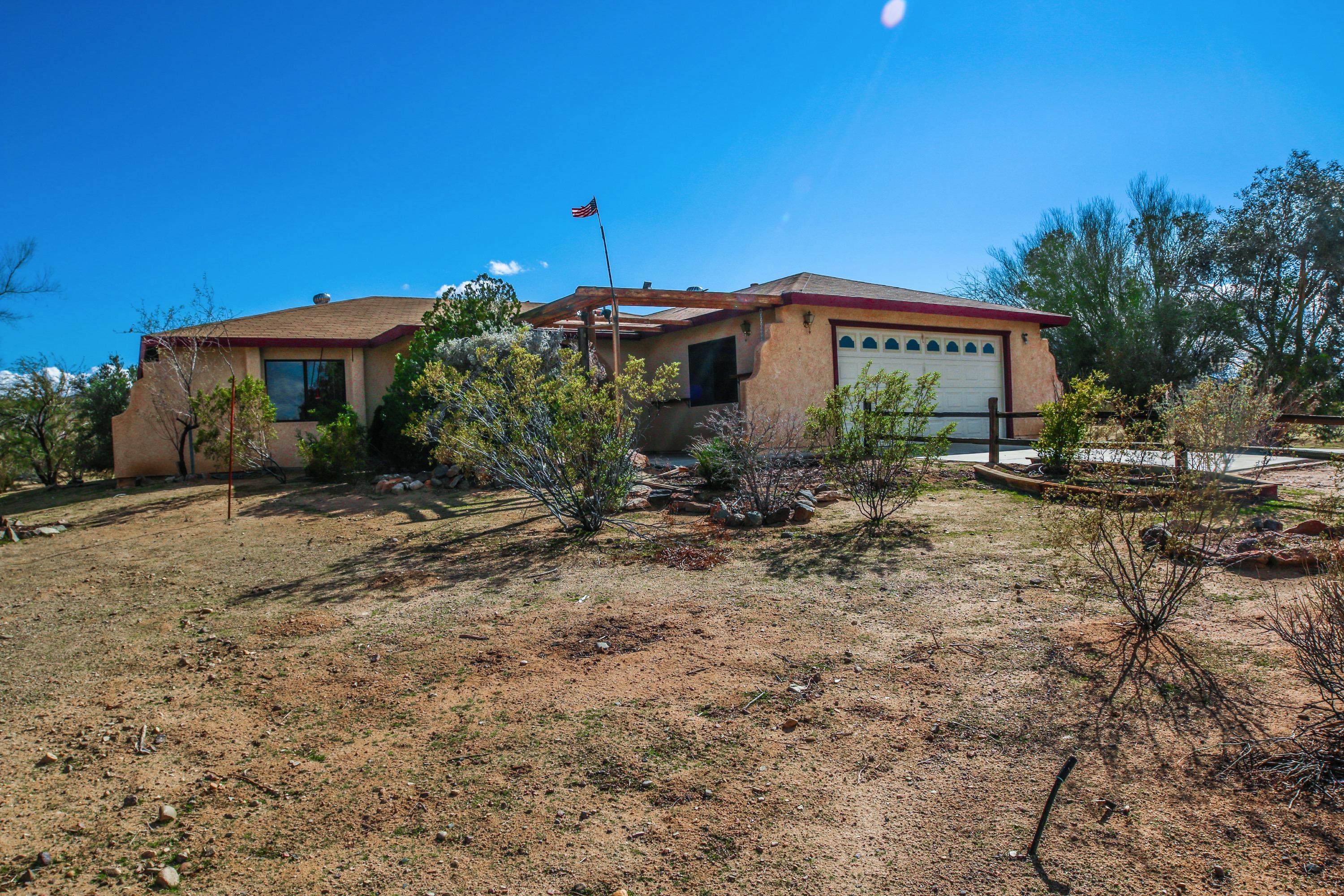 1517 Sunland Street Ridgecrest, CA 93555 - Photo 1 of 28 a view of a house with a yard