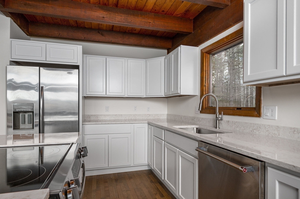 49 E Road Hawley, MA 01339 - Photo 12 of 42 a kitchen with a sink window and stainless steel appliances