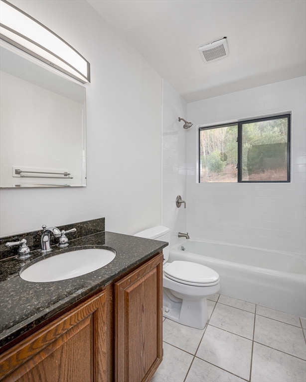 49 E Road Hawley, MA 01339 - Photo 16 of 42 a bathroom with a granite countertop sink toilet and a mirror