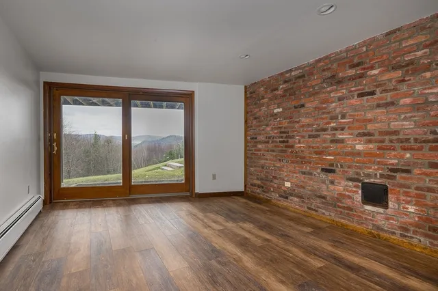an aerial view of a house swimming pool and mountain view