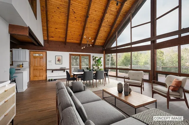 a kitchen with a sink window and stainless steel appliances
