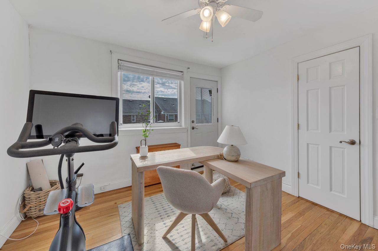 73-20 263rd Street, Unit G Queens, NY 11004 - Photo 16 of 24 a view of a workspace with furniture and a window