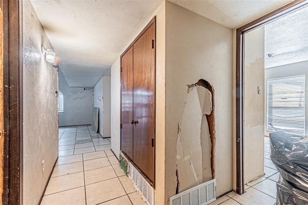 10315 Red Elm Road Dallas, TX 75243 - Photo 20 of 34 a view of a bathroom from the hallway