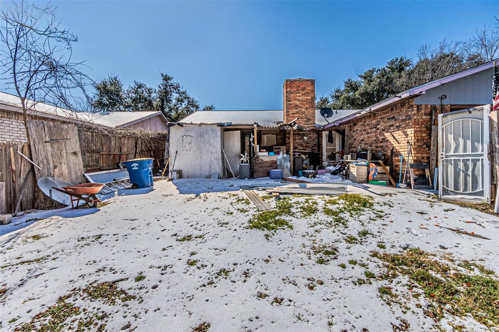 10315 Red Elm Road Dallas, TX 75243 - Photo 24 of 34 a view of a backyard with a patio and fire pit