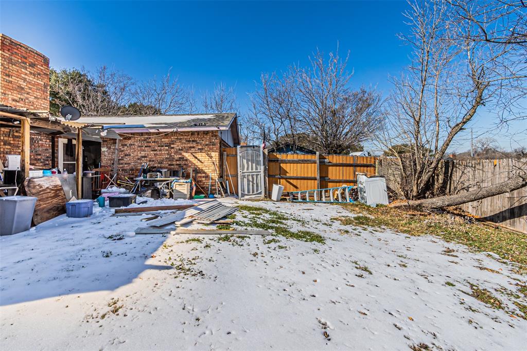 10315 Red Elm Road Dallas, TX 75243 - Photo 26 of 34 a view of a backyard of a house