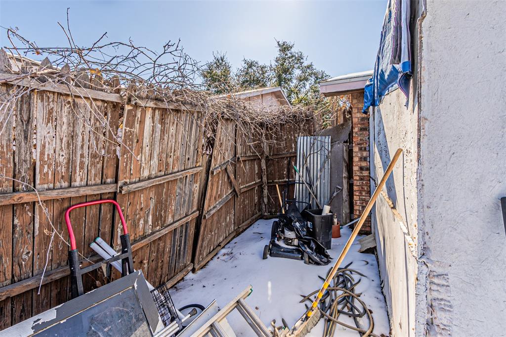 10315 Red Elm Road Dallas, TX 75243 - Photo 28 of 34 a view of a storage room with an bike