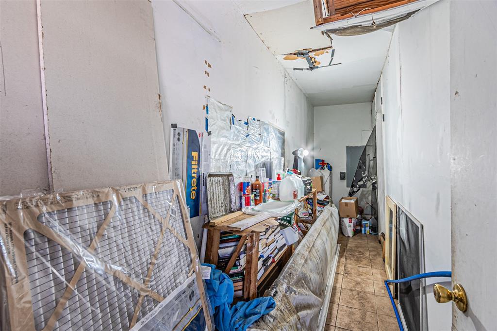 10315 Red Elm Road Dallas, TX 75243 - Photo 32 of 34 a view of a bedroom with furniture and toys