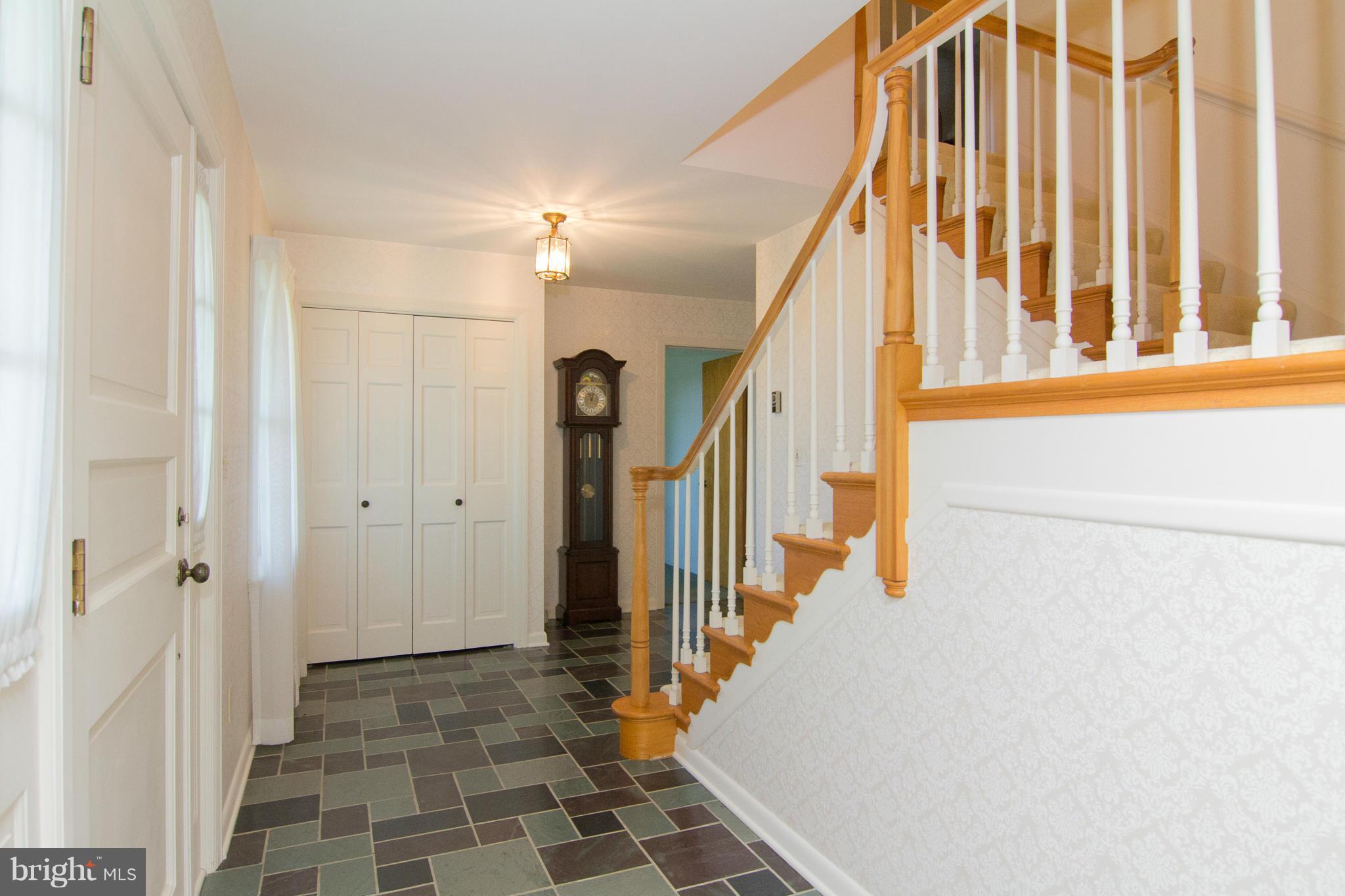 709 Sullivan Road Westminster, MD 21157 - Photo 14 of 30 a view of a hallway with wooden floor and staircase