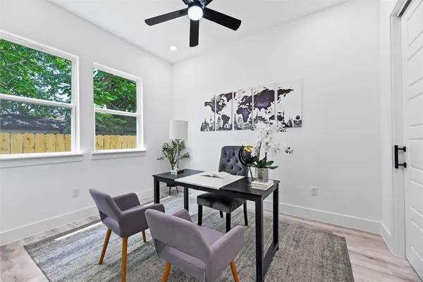 a view of a dining room with furniture window and outside view
