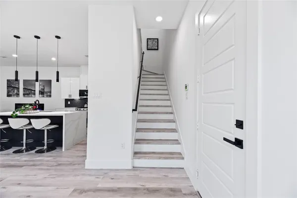 a view of a hallway with seating area