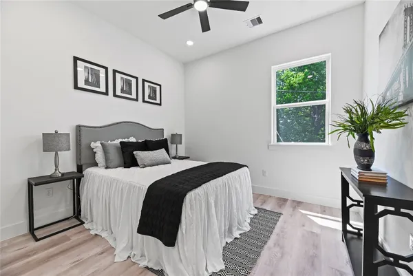 a bedroom with bed and a window