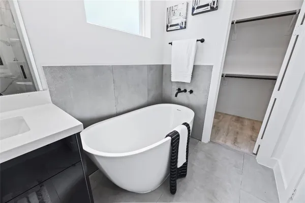 a bathroom with bathtub and shower