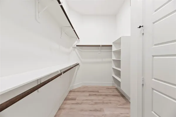a view of an empty walk in closet