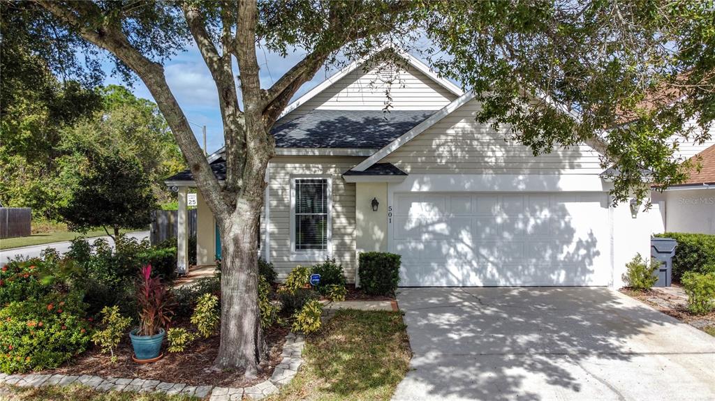 501 Hollinghead Loop Davenport, FL 33896 - Photo 1 of 1 a view of a house with yard and tree s