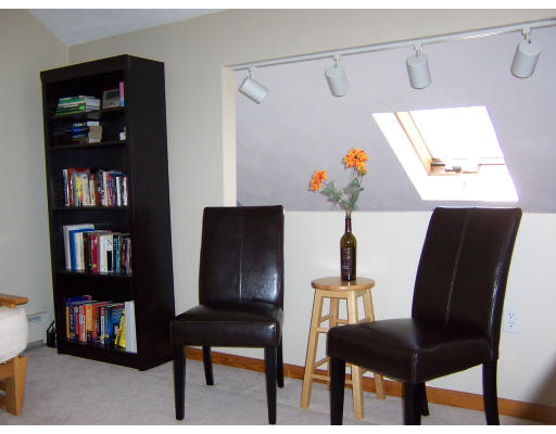 21 5th Avenue, Unit 21 Watertown, MA 02472 - Photo 11 of 15 a living room with furniture and a book shelf